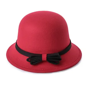Elegant red wool cloche hat for women with black ribbon bow, stylish winter headwear