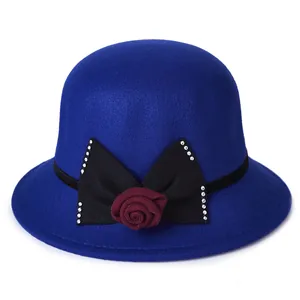 Elegant royal blue wool cloche hat for women with a black bow and red rose accent