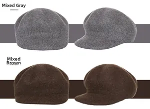 Detail view of wool newsboy hats in mixed grey and mixed light brown colors with wool texture
