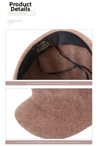 Detail of camel wool baker boy hat showing 100% wool label and adjustable inner drawstring