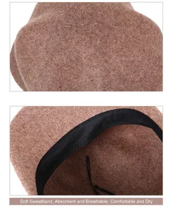 Detail view of camel wool beret showing inner sweatband and adjustable drawstring strap