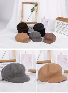Detail view of wool octagonal newsboy hats in black, grey, and khaki for winter