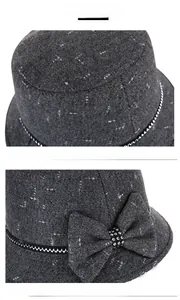 Detail of wool blend cloche hat with tweed texture and beaded bow decoration