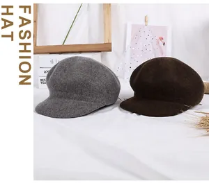Close-up of gray and brown wool newsboy hats with warm texture for autumn and winter