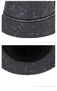 Detail of dark grey textured cloche hat showing woven fabric and interior sweatband