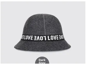 Detailed close-up of dark gray wool felt bucket hat with LOVE printed decorative ribbon