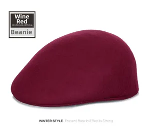 Close-up of wine red wool flat cap for winter showing rich fabric texture and warm finish