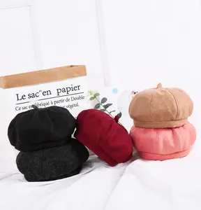 Detail shot of wool blend beret hats in various colors with soft felt texture finish