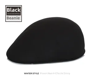 Detailed side view of a black wool winter flat cap with soft textured fabric