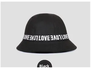 Detail of black wool fedora bucket hat with white LOVE letter printed ribbon decoration