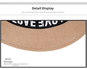 Detail view of khaki wool bucket hat featuring reinforced brim and interior embroidery