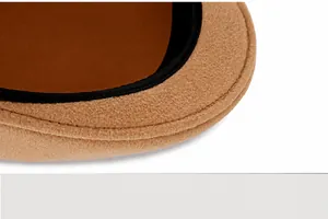 Detail of camel wool beret showing smooth double-stitched seams and premium felt texture