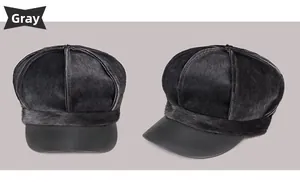 Detail of grey faux fur newsboy cap with multi-panel stitching and smooth texture