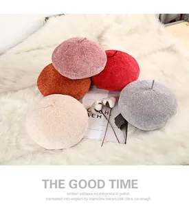 Detailed knit texture of vintage beret hats in pink, red, beige and grey colors