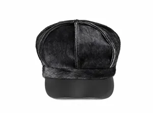Close-up of a black newsboy hat featuring premium faux fur texture and a leather brim