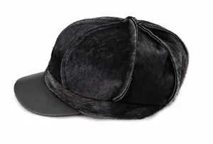 Close-up side view of dark grey faux fur newsboy cap with a black leather visor