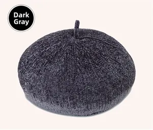Detail of dark grey chenille beret hat featuring soft knit texture and top stem detail