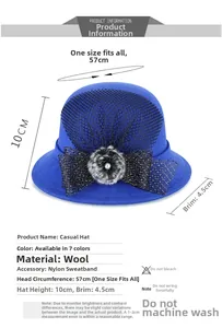 Blue wool cloche hat with black mesh bow, gray pompom and pearl detail specifications