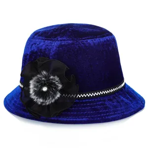 Close-up of royal blue velvet hat with layered mesh flower and pearl detail decor