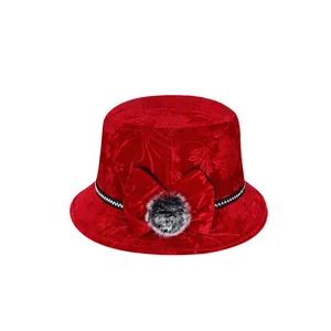 Elegant red velvet bucket hat for women featuring floral texture and bow with fur pom-pom