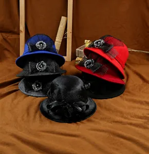 Detail of wool felt cloche hats with black mesh bows and floral bead accents for winter