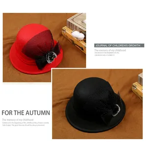 Detailed close-up of wool fedora for kids with large mesh bow and faux fur ball