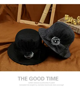 Detail of vintage cloche hat featuring mesh overlay bow and pearl faux fur accent
