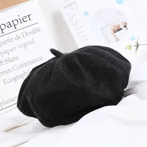 Classic black wool beret hat for women featuring a warm pumpkin style mushroom design
