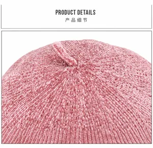 Detail view of pink chenille beret featuring soft textured knit and top stem detail