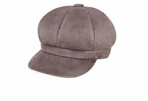 Side view of a vintage taupe newsboy cap with textured suede finish and top button