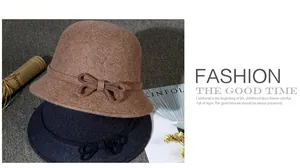 Detail view of wool felt cloche hats featuring elegant bow decoration and ribbon trim