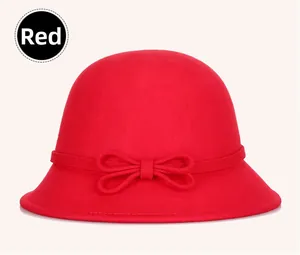 Detail of red wool felt cloche hat with an elegant bow accent for women's autumn style