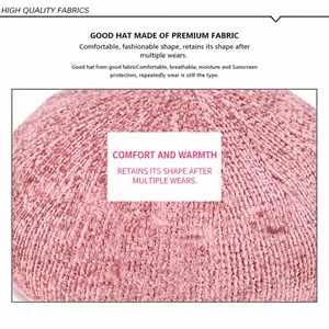 Detailed texture of thick pink chenille beret hat showing soft warm knit fabric