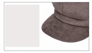 Detail of the suede newsboy cap brim showing fine texture and sun protection features