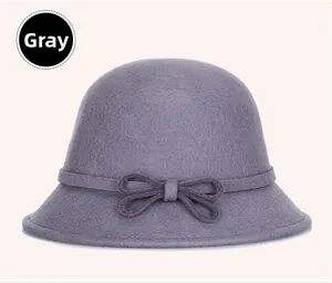 Detail of the gray Australian wool felt cloche hat with an elegant bow decoration