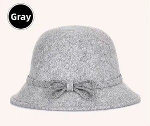 Detailed view of grey Australian wool cloche hat featuring a decorative bow on the side