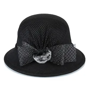 Elegant black wool cloche hat for women with mesh veil and large faux fur bow decoration