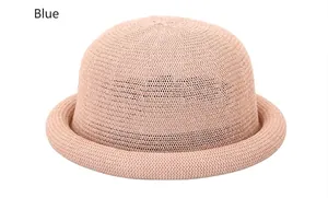 Close-up of elegant woven straw hat showing detailed breathable mesh and dome shape