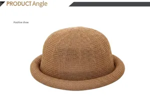 Front view of a brown woven straw dome hat with stylish rolled brim and texture