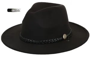 Detailed close-up of a black wool fedora featuring a braided leather band and gold crest button