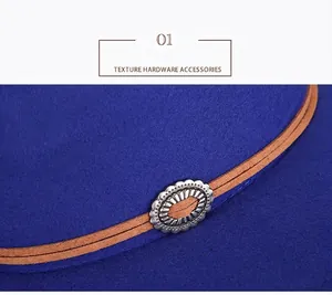 Close-up of vintage metal decorative buckle on a royal blue wool fedora hat band