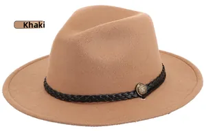 Detail of khaki wide-brim wool fedora hat with a black woven band and gold metal button