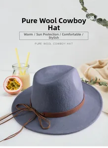 Detailed view of grey blue wool fedora hat featuring a brown leather decorative band