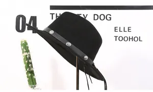 Detail view of a black wool fedora hat featuring a silver-studded decorative band on a stand