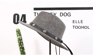 Detail of wool fedora hat with black leather band and antique silver studs on grey felt