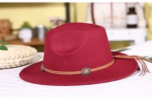 Detail of burgundy wool fedora with brown cord, vintage silver buckles and tassel fringe