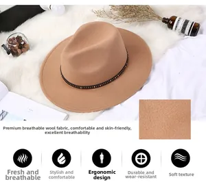 Detailed macro view of camel wool fedora hat with metallic studded belt and fabric texture
