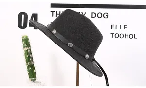 Detail of dark grey wool felt fedora featuring a black band with decorative silver rivets