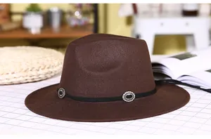 Close-up of dark brown wool fedora hat with black band and silver concho buckles