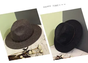 Close-up of wool fedora hats in grey and black with stylish metallic rivet bands